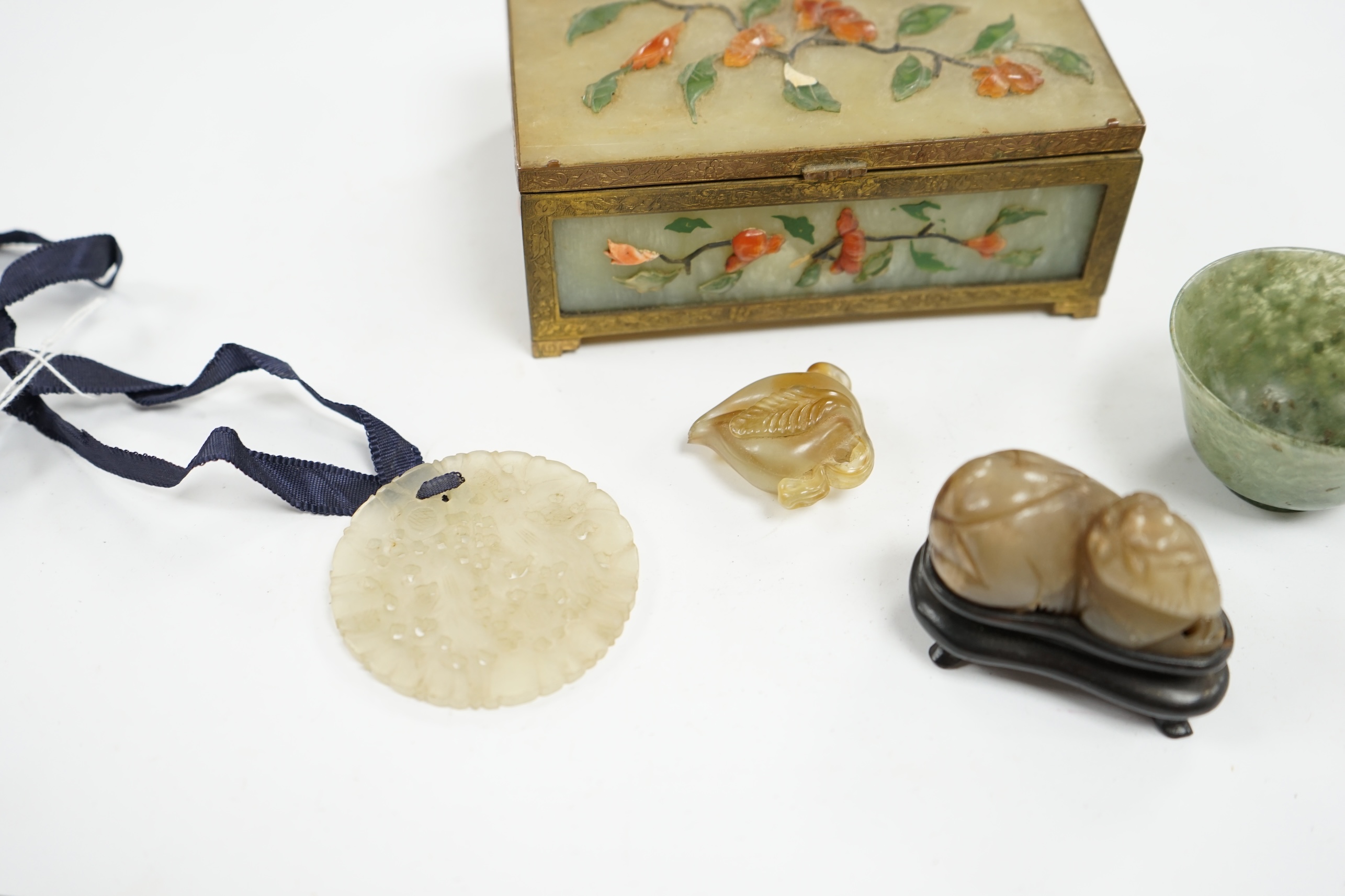 A group of Chinese jade and hardstone carvings to include a cigarette box & cover and a 14K mounted Yamanaka & Co pouch, largest 13cm wide. Condition - mostly fair